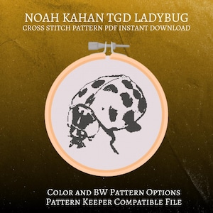 May include: A cross-stitch pattern of a ladybug in a wooden embroidery hoop. The ladybug is black and white, with a detailed design. Text at the top reads "NOAH KAHAN TGD LADYBUG" and "CROSS STITCH PATTERN PDF INSTANT DOWNLOAD". The bottom text says "COLOR AND BW PATTERN OPTIONS" and "PATTERN KEEPER COMPATIBLE FILE".