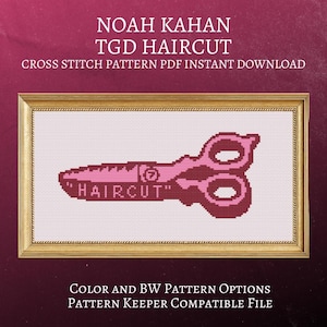 May include: A cross-stitch pattern featuring a pink and maroon scissors design with the word "HAIRCUT" stitched on the blade. The framed artwork is set against a white background, with text at the top and bottom.