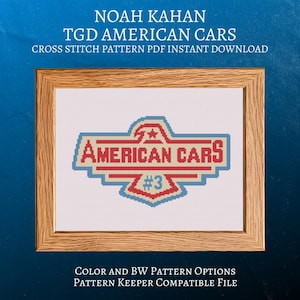 May include: Cross-stitch pattern with the words "AMERICAN CARS" in red, blue, and beige, with a star and the number 3. The design is framed in a wooden frame. The text "NOAH KAHAN" and "TGD AMERICAN CARS" are at the top.