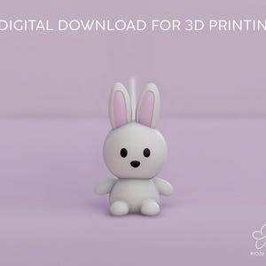 Op de afbeelding: Een wit 3D-geprint konijn met roze oren en zwarte ogen. Het konijn zit op een lichtpaarse achtergrond. Digitaal download voor 3D-printen.