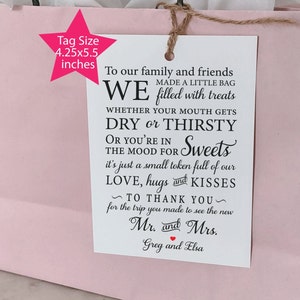 May include: White gift tag with black text that reads "To our family and friends WE made a little bag filled with treats whether your mouth gets DRY or THIRSTY or you're in the mood for Sweets it's just a small token full of our LOVE, hugs and KISSES ~ TO THANK YOU ~ for the trip you made to see the new Mr. and Mrs. Greg and Elsa"