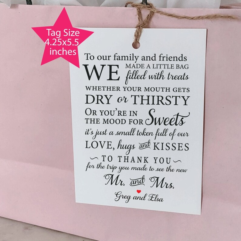 May include: White gift tag with black text that reads "To our family and friends WE made a little bag filled with treats whether your mouth gets DRY or THIRSTY or you're in the mood for Sweets it's just a small token full of our LOVE, hugs and KISSES ~ TO THANK YOU ~ for the trip you made to see the new Mr. and Mrs. Greg and Elsa"