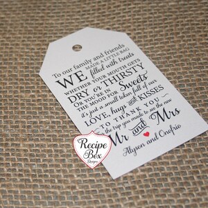 May include: White wedding favor tag with black text that reads "To our family and friends WE made a little bag filled with treats WHETHER YOUR MOUTH GETS DRY or THIRSTY OR YOU'RE IN THE MOOD FOR Sweets it's just a small token full of our LOVE, hugs and KISSES TO THANK YOU~ for the trip you made to see the new Mr and Mrs Alyson and Onofrio".