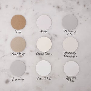 May include: Nine round paper samples in different colors and finishes, including Kraft, Blush, Shimmery Silver, Light Kraft, Classic Cream, Shimmery Champagne, Grey Kraft, Satin White, and Shimmery White.