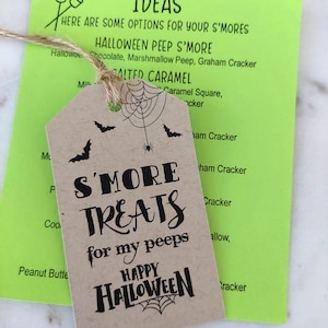 A Halloween S'more Treat Tag shown with twine. S'more Treats for my peeps. 
Instructions Paper with Ideas using Halloween peep marshmallows like ghost, Frankinstein, skulls and pumpkins. Happy Halloween