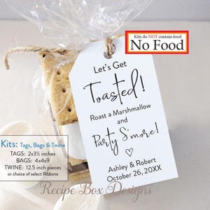 May include: A clear cellophane bag tied with twine, containing a graham cracker, marshmallow, and a tag that reads "Let's Get Toasted!" The tag is 2x3.5 inches. The bag is 4x4x9 inches. The twine is 12.5 inches. The tag also says "Party S'more!" and "No Food".