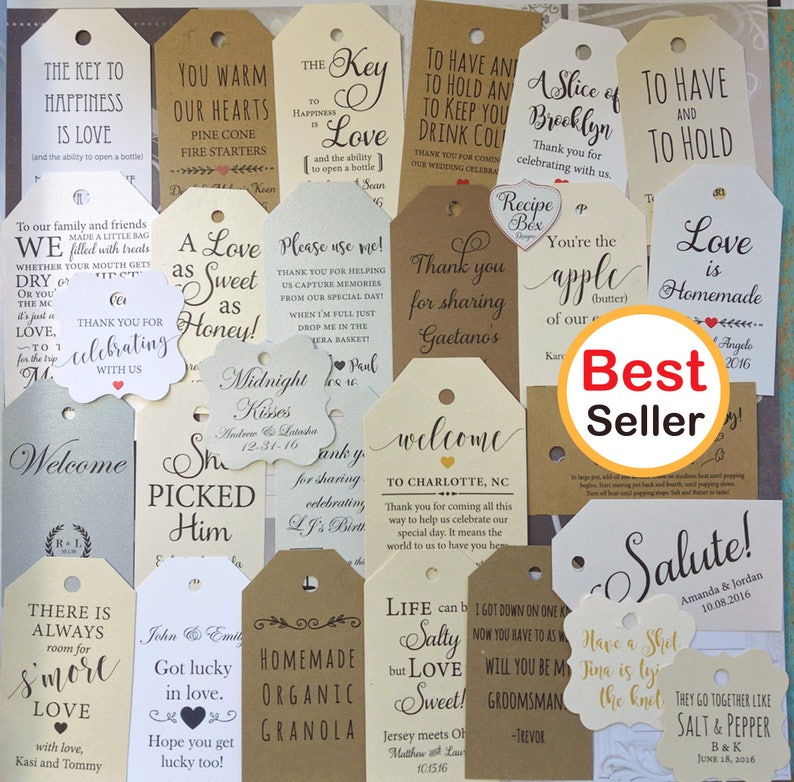 A collection of assorted wedding favor tags in various shapes and sizes. The tags feature handwritten calligraphy with phrases like "Love is Homemade" and "Thank you for sharing". A "Best Seller" sticker is visible.