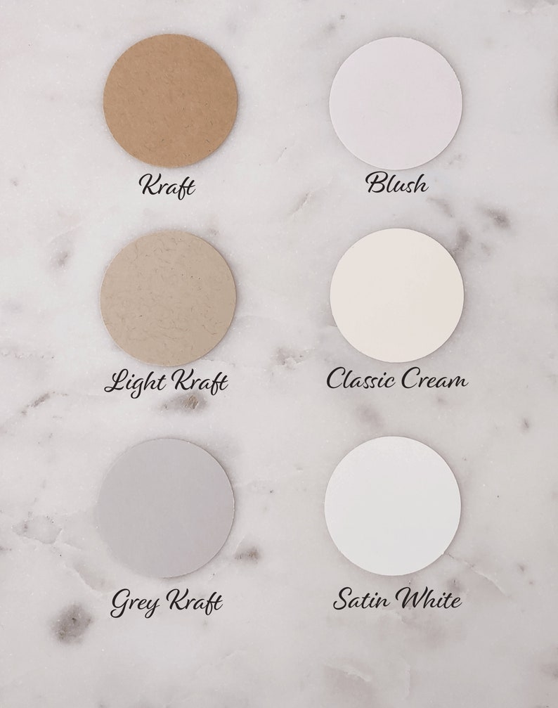 May include: Six circular paper samples in various neutral colors, including Kraft, Blush, Light Kraft, Classic Cream, Grey Kraft, and Satin White. Each sample has a label with its color name in a handwritten font.