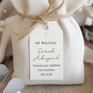 Favor tags for Mi Bautizo Printed in Spanish. They with a gold cross at the top of the tag and childs name is printed on the tag.  Listing is for tags only. Option to purchase twine string at checkout. (The tag is displayed on a burlap bag but is not included)