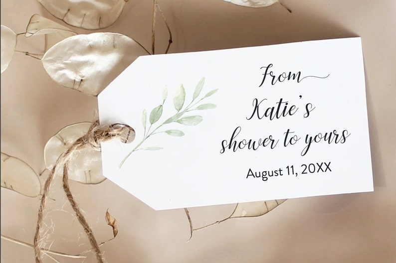 May include: White gift tag with a green watercolour leaf design. The text reads "from Katie's shower to yours August 11, 20XX".
