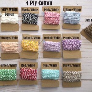 May include: A selection of 4-ply cotton twine in various colors, including white, black, pink, light blue, light orange, daffodil, orchid, purple, green, red, teal, and brown. The image also shows a jute twine option. Each twine is displayed on a small cardboard card.