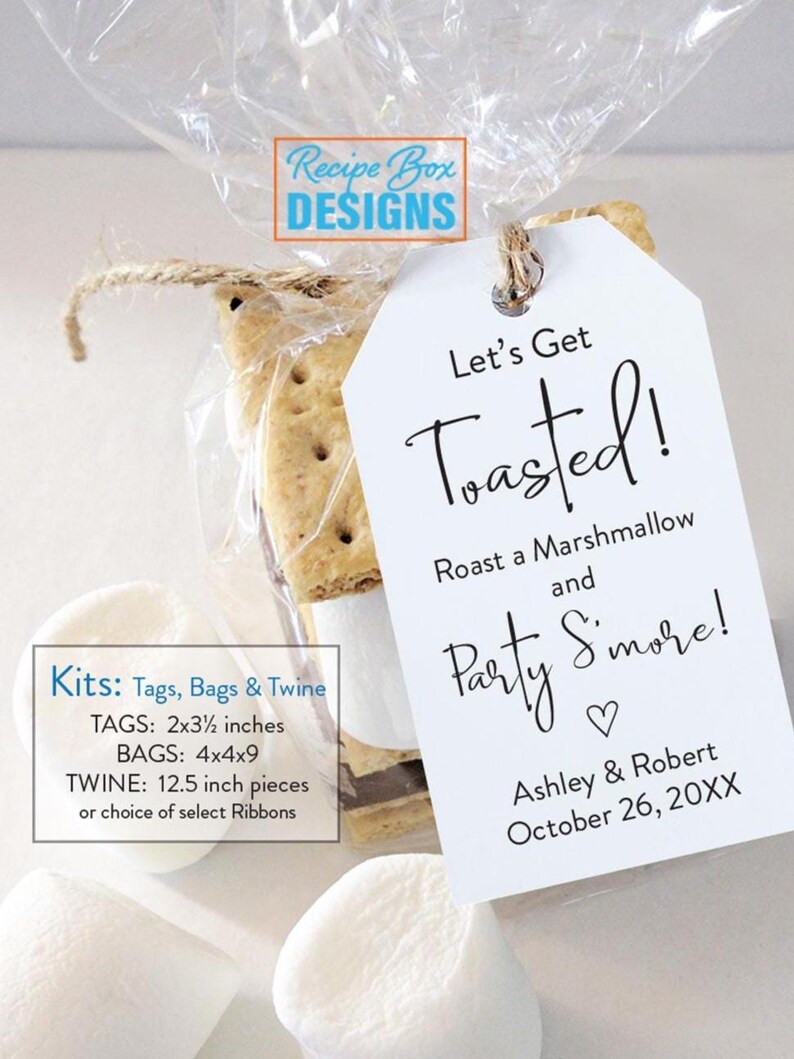 May include: A clear cellophane bag tied with twine, containing a s'mores treat. A white tag with the words "Let's Get Toasted!" is attached. The tag also includes the names Ashley & Robert and the date October 26, 20XX.