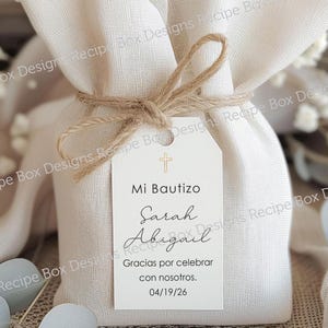 Favor tags for Mi Bautizo Printed in Spanish. They with a gold cross at the top of the tag and childs name is printed on the tag.  Listing is for tags only. Option to purchase twine string at checkout. (The tag is displayed on a burlap bag but is not included)