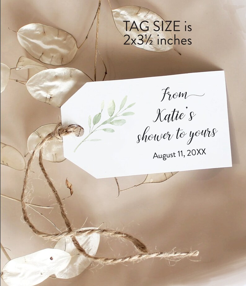 May include: A white gift tag with a green leafy branch design. The tag is tied with twine and has the text "from Katie's shower to yours" and "August 11, 20XX". The tag size is 2x3 1/2 inches.
