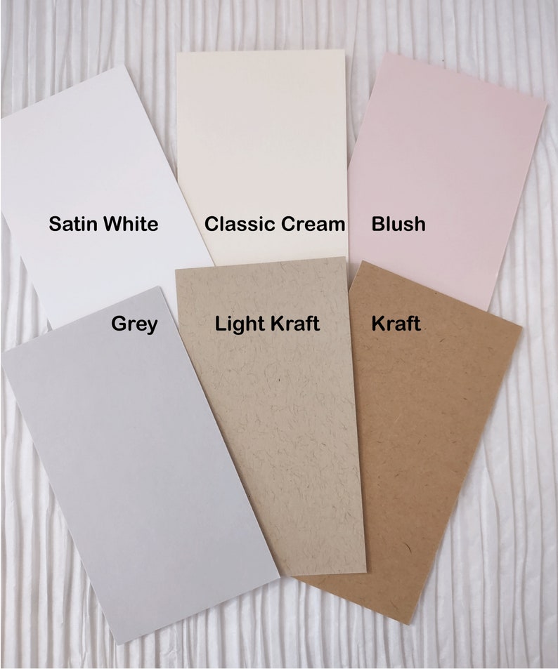 May include: Six different cardstock paper samples in various colors and textures. The colors are Satin White, Classic Cream, Blush, Grey, Light Kraft, and Kraft.