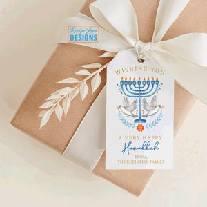 May include: A gift wrapped in brown paper, tied with a white ribbon, and a Hanukkah gift tag. The tag features a blue menorah, doves, and the text "Wishing You A Very Happy Hanukkah".