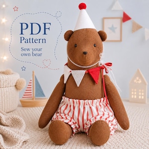 May include: A brown plush bear wearing a white party hat with a red pom-pom and red and white striped bloomers. The bear features a red and white triangular bunting collar. Text on the left reads PDF Pattern Sew your own bear.