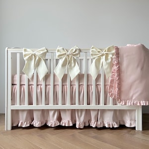 Charming Pastel Nursery Set: Combination of Pale Pink and Ivory with Ruffled Crib Skirt, Crib Fitted Sheet, Baby Blanket and Decorative Bows