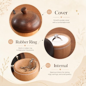 May include: A round wooden jewelry box featuring a smooth dark wood cover with a knob, a built-in rubber ring for securing jewelry, and a spacious interior. The box is shown with a silver ring and a delicate chain necklace inside.