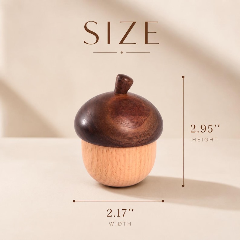 May include: A wooden acorn-shaped container with a dark brown cap and a light tan base. The text SIZE is at the top. A vertical line indicates a height of 2.95 inches, and a horizontal line indicates a width of 2.17 inches for the object.