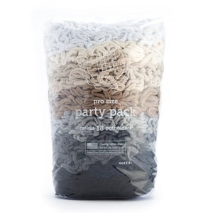 May include: A clear plastic bag filled with loops of yarn in various shades of gray, brown, and white. The bag is labeled "pro size party pack makes 18 potholders".