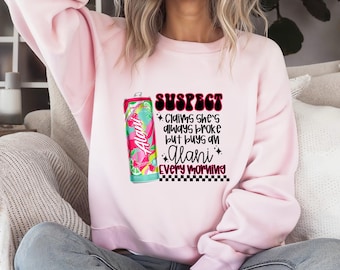 Suspect Claims She’s Always Broke But Buys Alani Every Day Tshirt/Long Sleeve/Sweatshirt/Hoodie, TikTok Viral , Funny, Drink trend , Alani