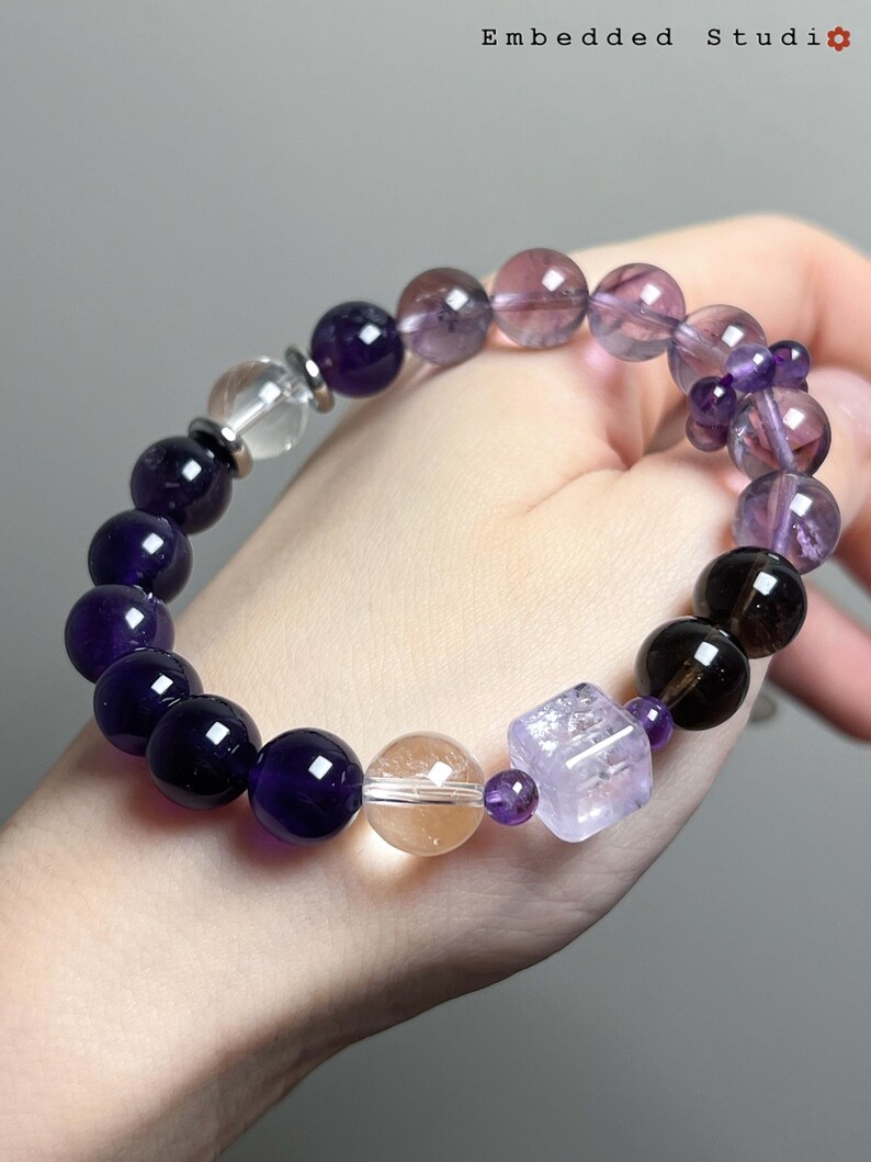 Side view of a natural amethyst bracelet worn on the wrist, showing fit and luster.