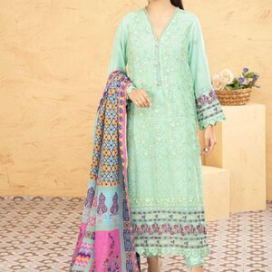 May include: A light green embroidered dress with a pink and blue patterned dupatta. The dress has a V-neckline and long sleeves. The dupatta has a floral design and a border.