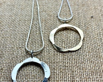 Flower inspired silver necklace. Formed and hammered from heavy 10 gauge sterling silver.