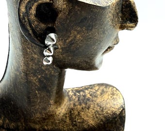 SINGLE earring. Single post with 3 graduated silver cones.