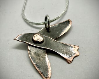 Bird in flight Copper oxidized Necklace with metal rivet connection. Silver snake chain