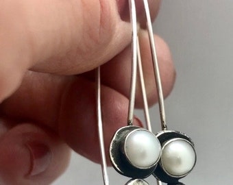 Recycled sterling silver fresh water pearl dangle earrings. Hammered and oxidized detail. Handmade