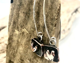 Recycled copper and silver raised heart dangle earrings. Hammered and oxidized detail. Handmade