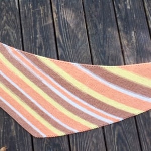 May include: A triangular shawl with diagonal stripes in shades of peach, yellow, and brown.