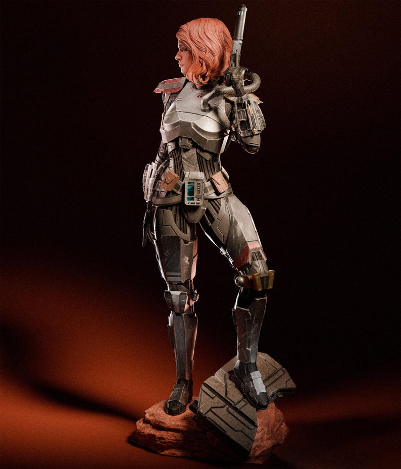 May include: A detailed statue of a female warrior in futuristic armor, holding a blaster rifle. The figure has short, reddish-pink hair and stands on a rocky base. The armor is primarily silver and gray with brown accents, and the overall design suggests a science fiction theme.