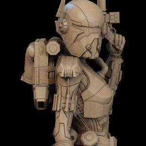 May include: A detailed, tan-colored sculpture of a futuristic figure in a helmet and body armor, holding a gun. The figure has a backpack and various mechanical components, set against a black background. The design suggests a science fiction or space theme.