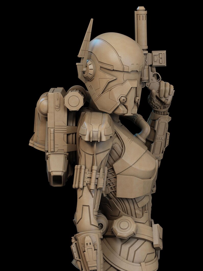 May include: A detailed, tan-colored sculpture of a futuristic figure in a helmet and body armor, holding a gun. The figure has a backpack and various mechanical components, set against a black background. The design suggests a science fiction or space theme.