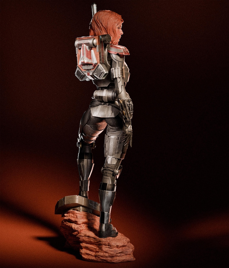 May include: A detailed figurine of a female character in futuristic armor, standing on a rocky base. The figure has red hair and a backpack with red and silver accents. The armor is primarily silver and black, with intricate detailing.
