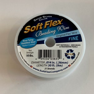 May include: A spool of Soft Flex beading wire in satin silver color. The label indicates it is fine, nylon-coated, stainless steel wire with a test strength of 10 lbs. The diameter is .014 in. (.36mm), and the length is 30 ft. (9m).