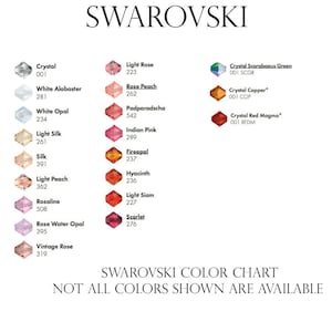 May include: A Swarovski color chart displaying various crystal colors with their corresponding names and numbers. Colors include Crystal, White Alabaster, Light Rose, and Scarlet. The text "SWAROVSKI COLOR CHART" is at the bottom.