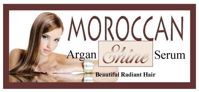 May include: Image of a woman with long, brown hair, promoting Moroccan Argan Shine Serum. The product name is displayed in elegant script, with the words "Beautiful Radiant Hair" below. The image is framed in a dark brown border.