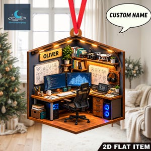 May include: A hexagonal, flat, two-dimensional hanging ornament featuring a detailed illustration of a home office workspace. The scene includes a desk, computer monitors, a chair, shelves with books, and a sign with the name OLIVER.