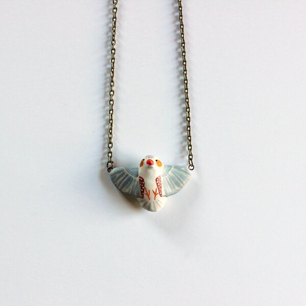 Penguin zebra finch in flight necklace