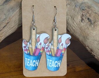 TEACH pennburk örhängen