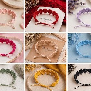May include: A collection of handmade crochet heart bracelets in various colors, including pink, red, purple, and blue. Each bracelet features a delicate heart design and adjustable ties. Some cards say "Made with love" and "Thank you".