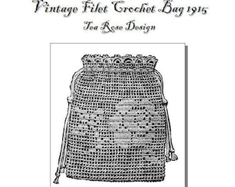 May include: Vintage 1915 filet crochet bag pattern with a tea rose design. The pattern is black and white and shows a crocheted bag with a drawstring.