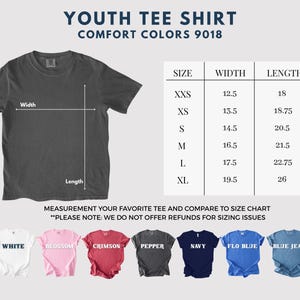 May include: A dark gray youth tee shirt with a size chart. The chart lists sizes XXS to XL, with widths from 12.5 to 19.5 inches and lengths from 18 to 26 inches. The shirt is labeled "YOUTH TEE SHIRT" and "COMFORT COLORS 9018".