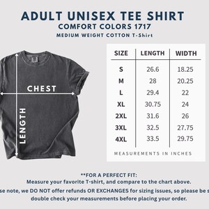 May include: A charcoal gray unisex t-shirt with a size chart showing chest and length measurements in inches. The text on the shirt reads "ADULT UNISEX TEE SHIRT COMFORT COLORS 1717 MEDIUM WEIGHT COTTON T-Shirt."