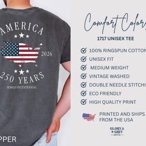 May include: Pepper-colored unisex tee with a graphic celebrating America's 250th anniversary. The design features the American flag within a map outline, the years 1776 and 2026, and the text "AMERICA" and "250 YEARS". The shirt is made of 100% ringspun cotton.