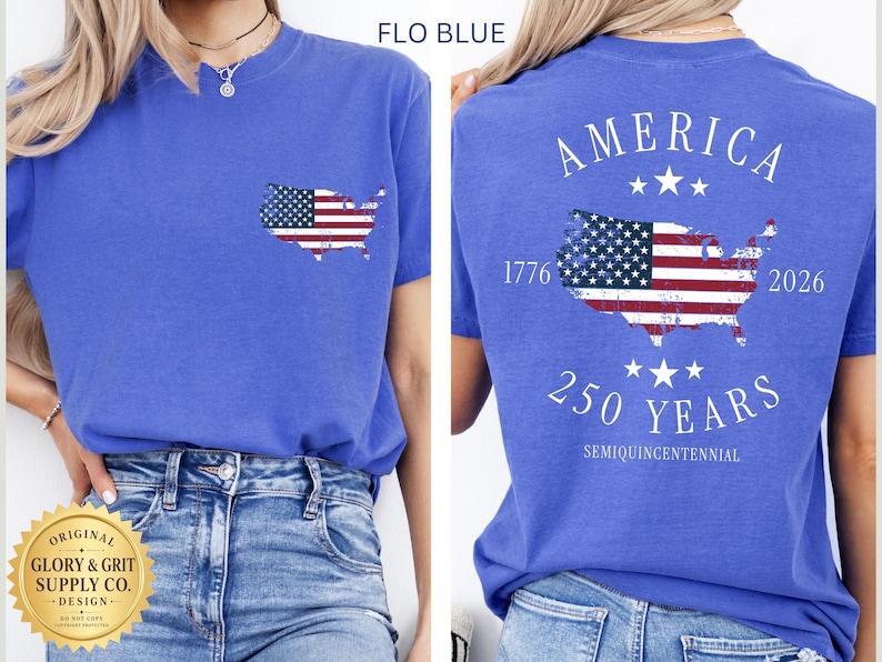 May include: Flo blue t-shirt with a pocket featuring an American flag map. The back of the shirt displays "AMERICA" above a flag map, "1776-2026", and "250 YEARS SEMIQUINCENTENNIAL".